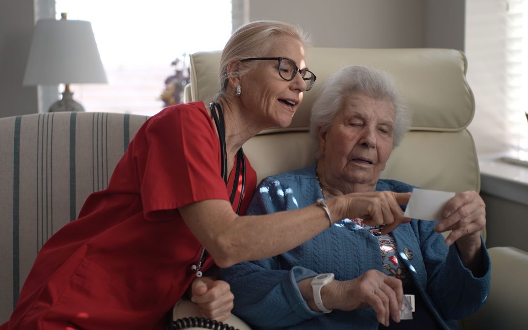 memory care worker engages a senior resident